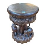 Solid carved wood elephant stool, 41cm high.