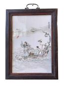 Small Chinese porcelain panel in wood frame decorated with figures in naturalistic wood boat,