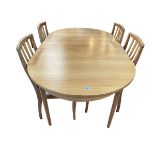 Teak extending dining table and four chairs, 210cm maximum length.