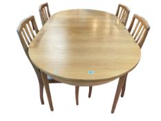 Teak extending dining table and four chairs, 210cm maximum length.