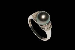 9 carat gold, black pearl and diamond ring.