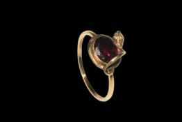 Gold garnet and snake ring, size O.