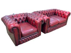 Red leather button back Chesterfield settee and chair.