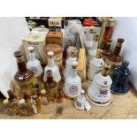 Collection of 15 Bells Scotch Whisky decanters and bottles, 28 pieces in total.