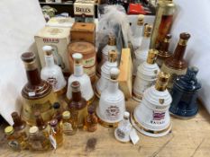 Collection of 15 Bells Scotch Whisky decanters and bottles, 28 pieces in total.