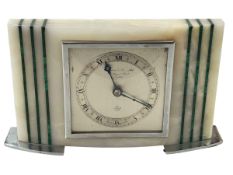 Elliott clock in malachite inlaid marble case.