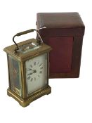 Gilt brass carriage clock with case and key.