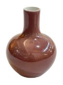 Chinese bottle vase in plum glaze, seal mark to base, 18cm.
