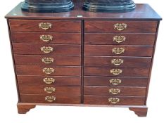 Mahogany finish filing chest of two banks of four drawers raised on bracket feet, 99cm by 40cm.