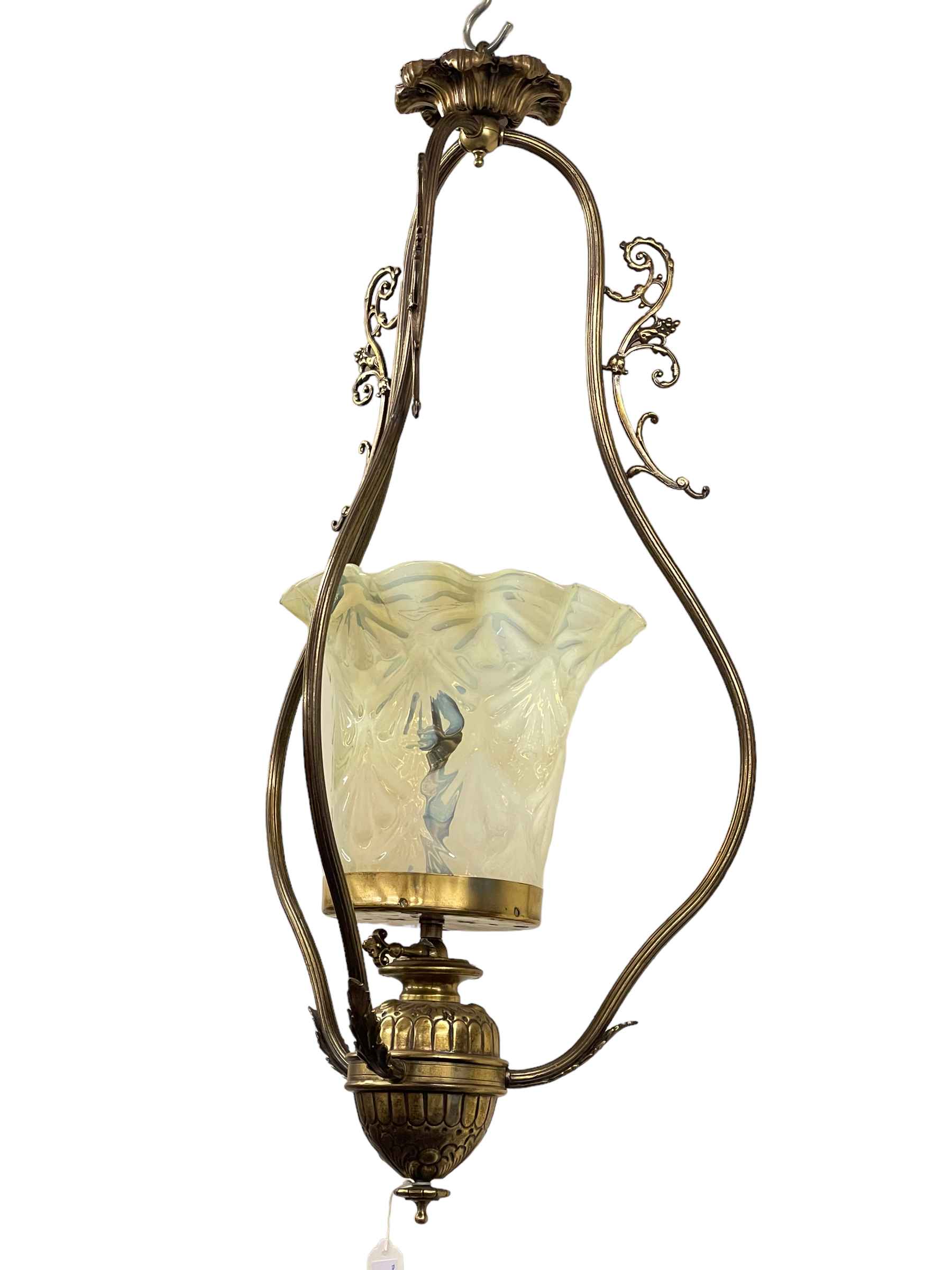 Ornate brass ceiling light with vaseline shade.