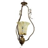 Ornate brass ceiling light with vaseline shade.