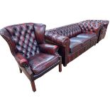 Three piece button backed ox blood leather three seater Chesterfield suite.