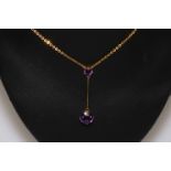 9 carat double amethyst pendant and chain.