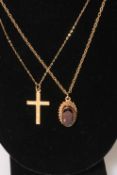 9 carat gold cross with chain, and garnet pendant with chain (2).