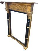 Gilt and ebonised pier mirror with Corinthian columns to each side, 117cm by 101cm.