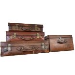 Four vintage leather cases.