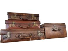 Four vintage leather cases.