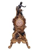 Large highly ornate gilt clock decorated with figures, quartz movement, 107cm by 56cm by 37cm.