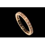 18 carat rose gold and diamond eternity ring, size L.