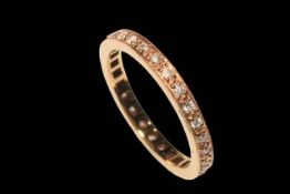 18 carat rose gold and diamond eternity ring, size L.