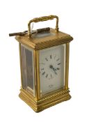 St James, London, gilt brass carriage clock, 15cm to top of handle.
