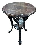 Ornate cast based pub table.