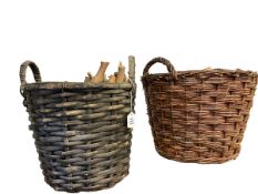 Two wicker handled baskets.