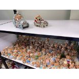 Collection of Pendelfin figures including stands.