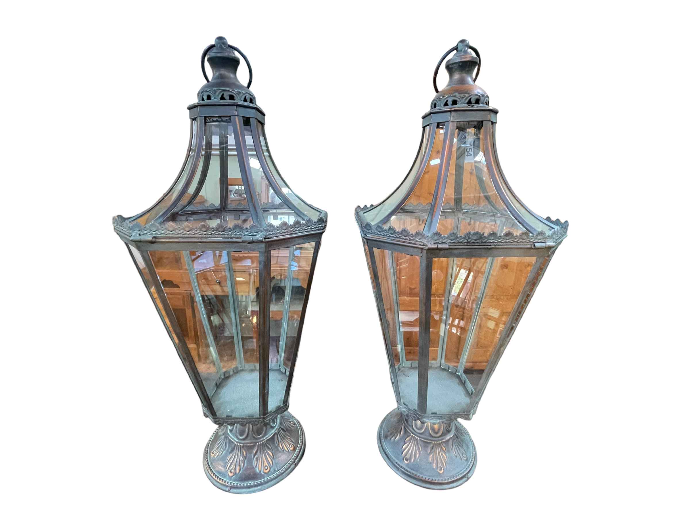 Pair of ornate metal and glazed hall hanging lanterns.
