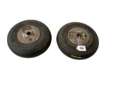 Two Supermarine Spitfire tail wheels.