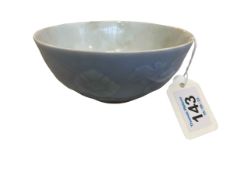 Chinese blue bowl with relief flowers and lotus border, six character mark, 13cm diameter.