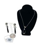 Black onyx and diamond necklace and earrings set in 18 carat white gold and with 18 carat chain.