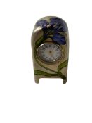 Good Continental silver and enamel Boudoir clock decorated with iris on matt finish ground, 5.5cm.