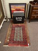 Two Eastern rugs, small dome trunk and contents and five pictures.