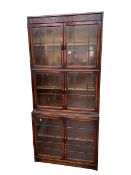 Early 20th Century Gunn oak three height stacking bookcase with six leaded glazed doors,