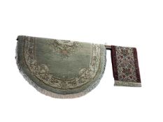 Oval green and floral decorated Anglo Indian carpet and traditional carpet runner, 3.70 by 0.70 (2).