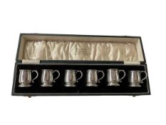 Carved set of six Wilson & Sharp Ltd silver tankard tots, Birmingham 1934.