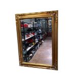 Rectangular gilt framed bevelled wall mirror, 119.5cm by 89.5cm.