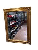 Rectangular gilt framed bevelled wall mirror, 119.5cm by 89.5cm.