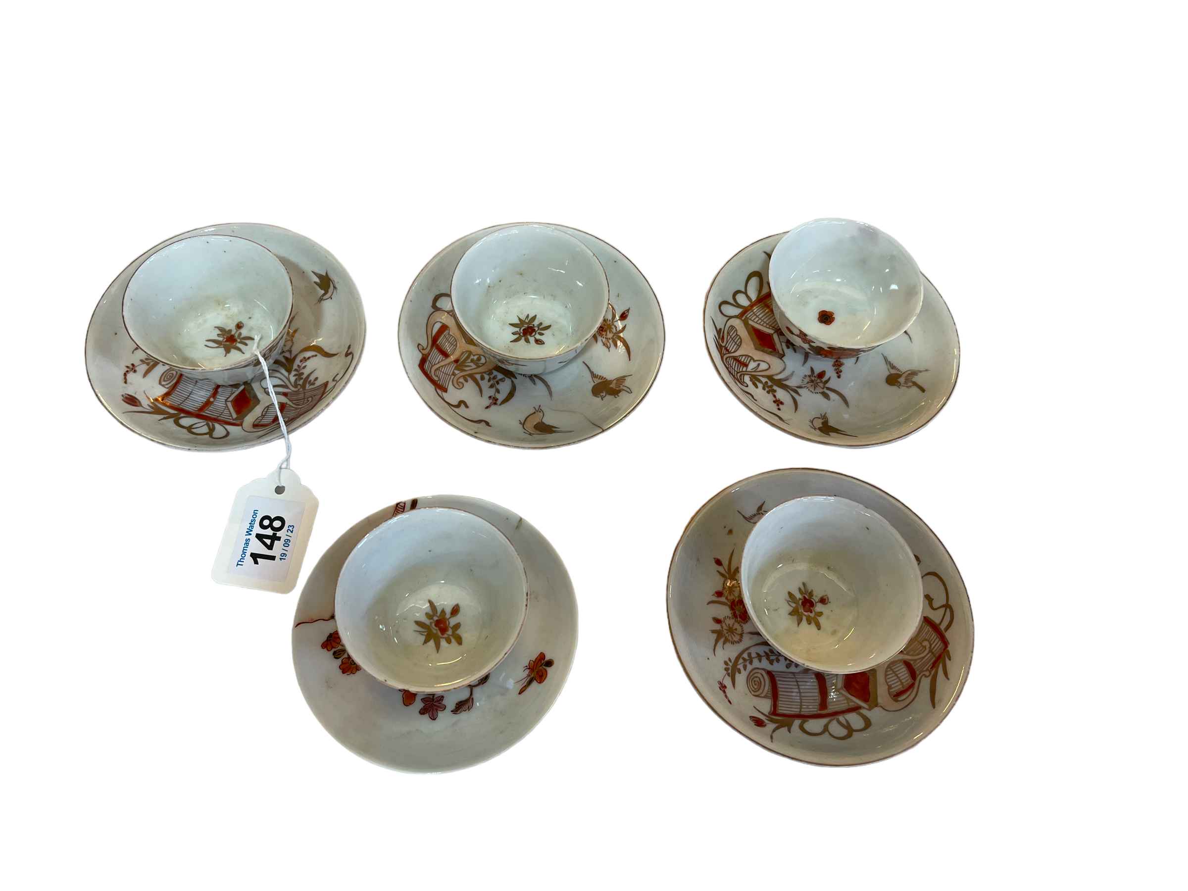 Set of five Chinoiserie tea bowls and saucers.