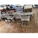 Metal lattice work design garden table and six folding chairs, table 153cm by 76cm.