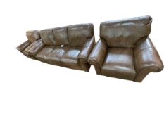 Contemporary tan leather three piece lounge suite.