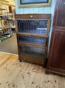 Early 20th Century mahogany three height leaded glazed door bookcase with base drawer,