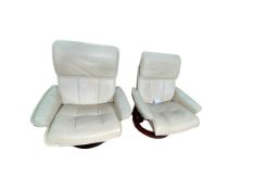 Pair Stressless ivory leather reclining chairs.