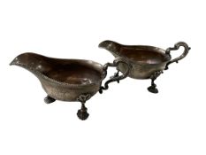 Pair antique silver substantial gravy boats with gadroon borders and armorial,
