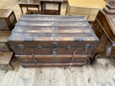 Vintage wood and metal bound travelling trunk, 65cm by 98cm by 58cm.