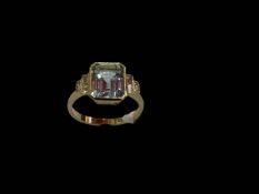 Aquamarine and diamond 18 carat gold ring having emerald cut aqua with baguette shoulders, size N/O.