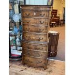 Mahogany seven drawer bow front tallboy chest with brush slide, 157cm by 69cm by 43cm.