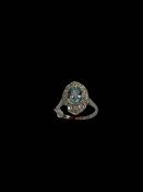 Aquamarine and diamond platinum ring, the oval aqua bordered with fourteen diamonds, size O/P.