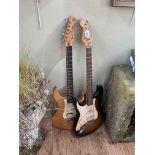 Two electric guitars, named Strat Squire and Pacifica Yamaha.